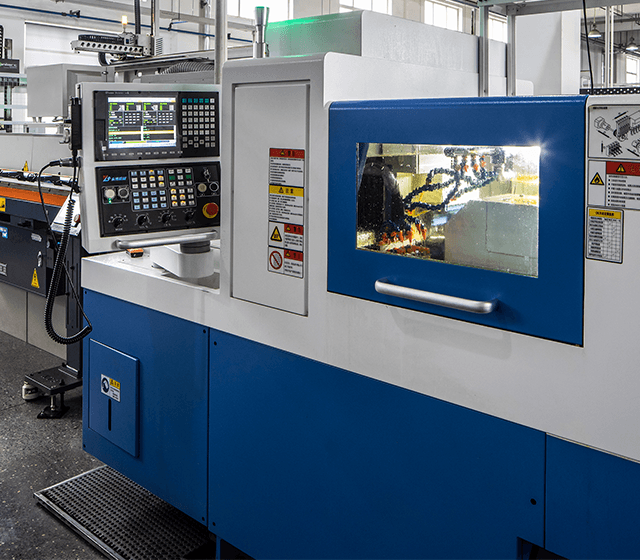 Close-up of a modern CNC machine in operation inside the Uniarc Group manufacturing facility.